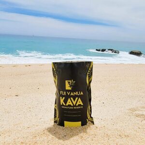 A can of kava sitting on the beach.